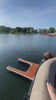 Dog using Dog-DOK as a pontoon boat ramp showing the effortless exit and entry from the lake