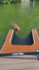 Dog swimming up the dog-dok ramp showing that it is made with a much thicker mesh material than other dog pool ramps